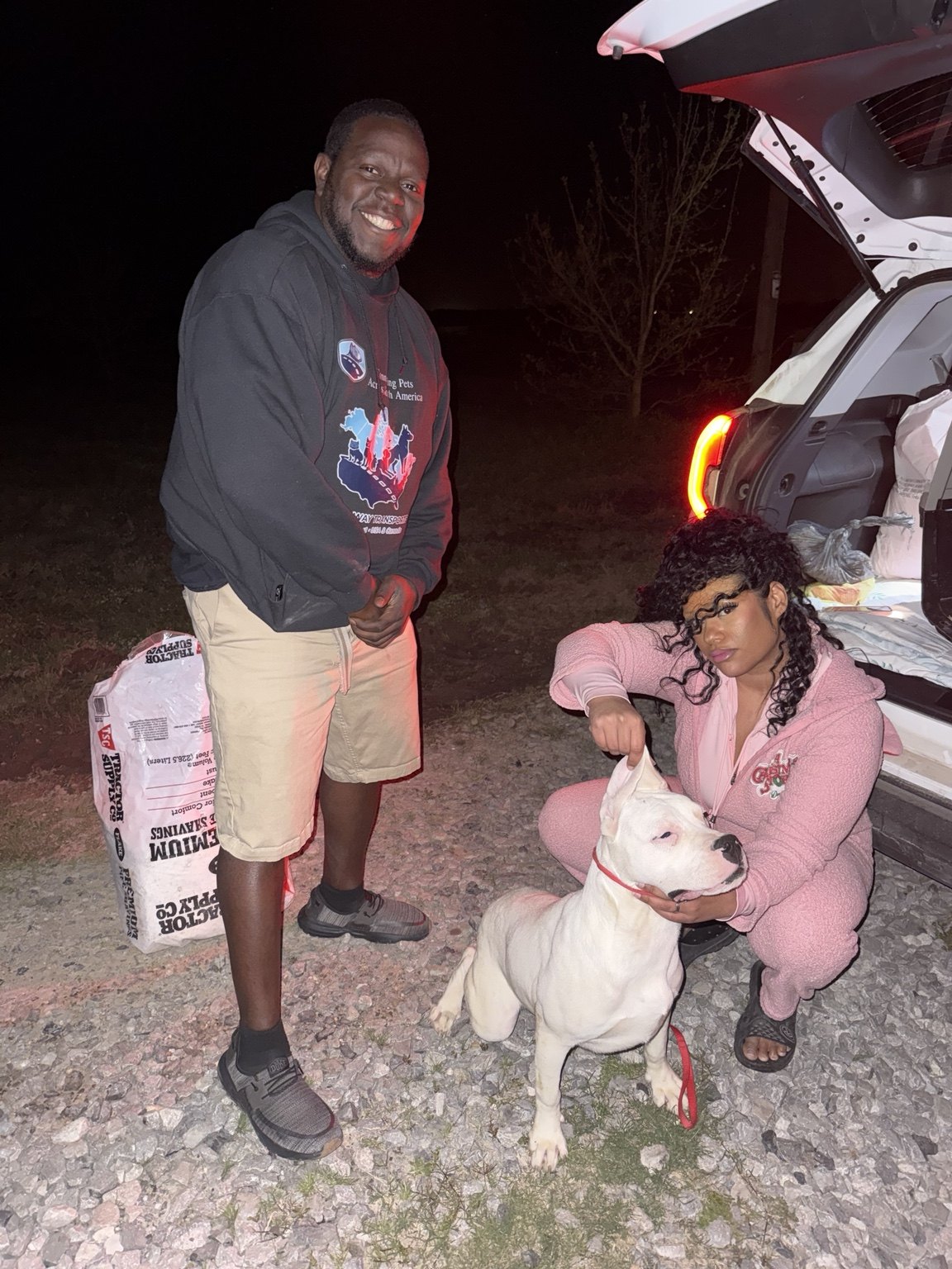 Nigel with a pet during a delivery handoff